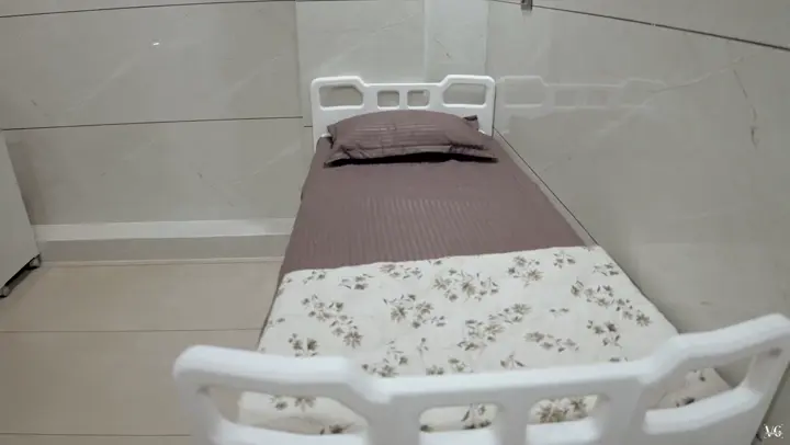 Clean patient room with a hospital bed