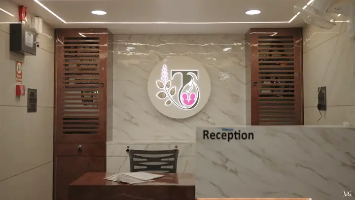 Tulsi reception desk with the hospital logo
