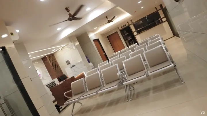 Bright waiting area with rows of cushioned seating